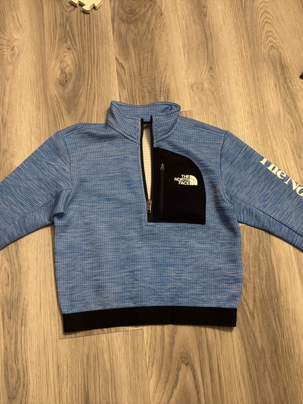 The North Face Light Blue Quarter-Zip Pullover with Black Pocket